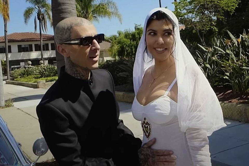 <p>hulu/youtube</p> Travis Barker and Kourtney Kardashian at their courthouse wedding