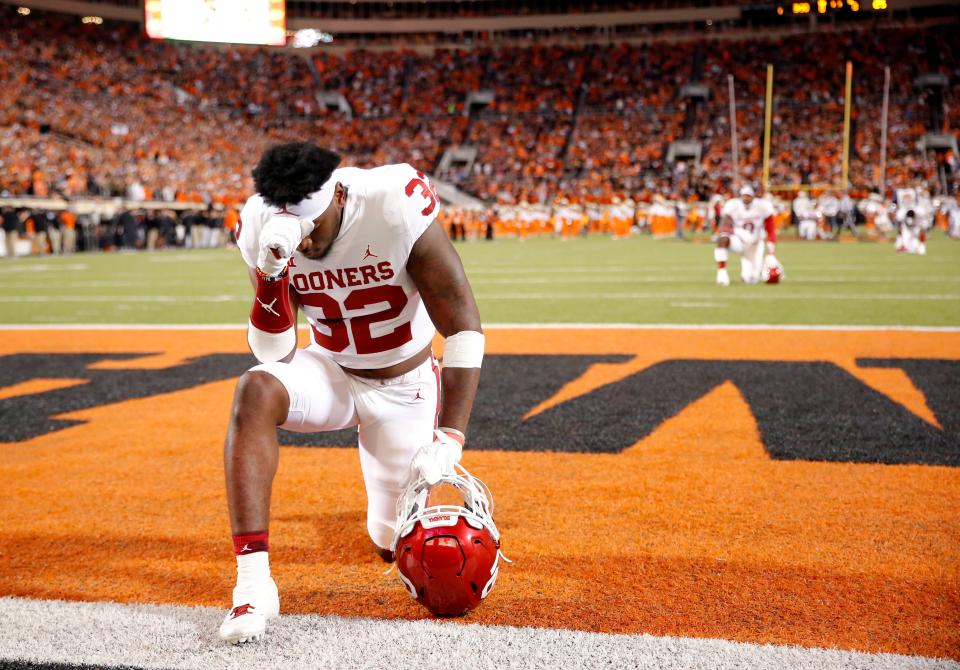 Oklahoma's Delarrin Turner-Yell (32) takes a moment before a Bedlam college football game between the Oklahoma State University Cowboys (OSU) and the University of Oklahoma Sooners (OU) at Boone Pickens Stadium in Stillwater, Okla., Saturday, Nov. 27, 2021. OSU won 37-33.