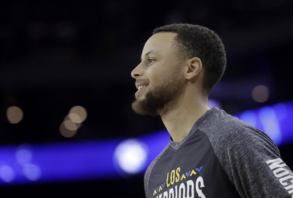 Golden State Warriors guard Stephen Curry before an NBA basketball game against the San Antonio Spurs in Oakland, Calif., Thursday, March 8, 2018. (AP Photo/Jeff Chiu)