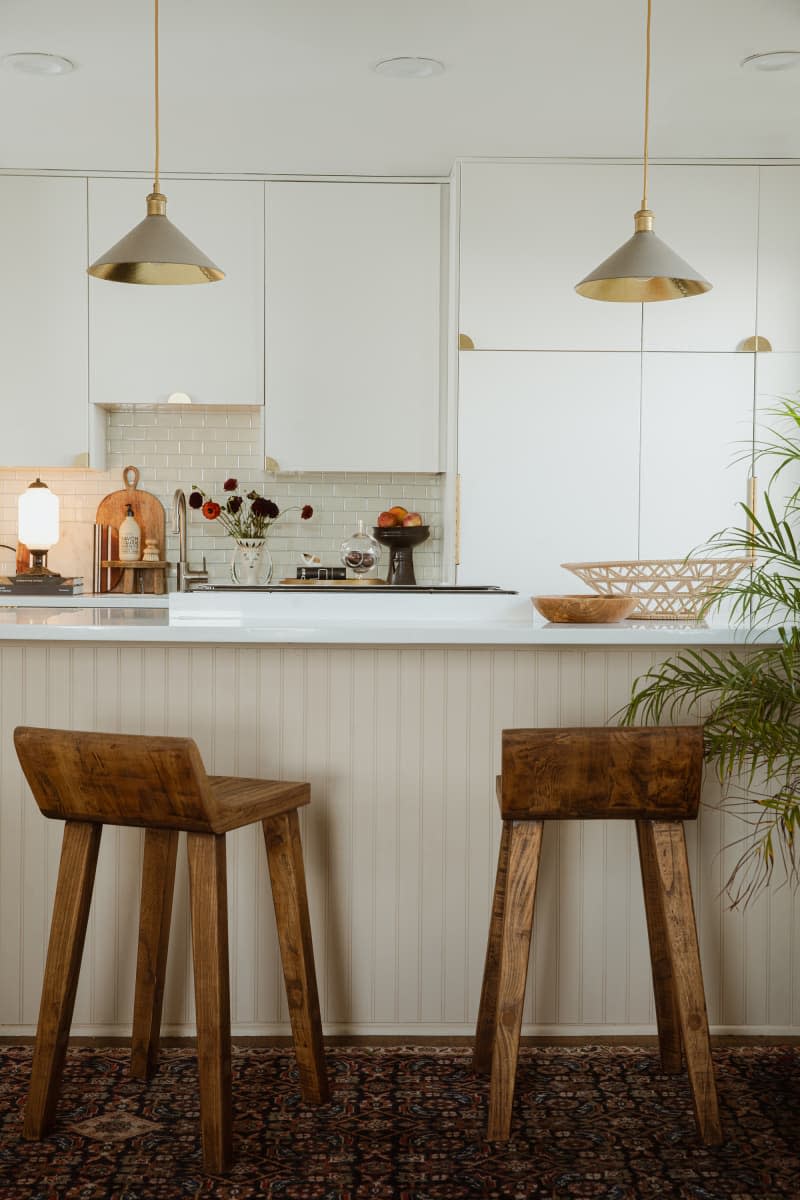 Pendant lamp hung above bar in kitchen.