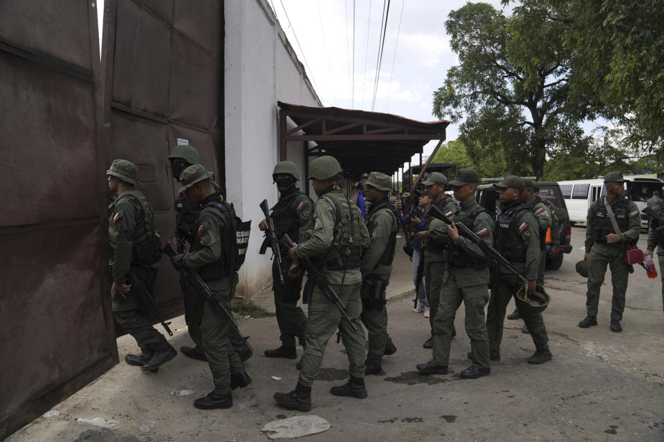 FILE - Soldiers raid the Tocorón Penitentiary Center, in Tocorón, Venezuela, Wednesday, Sept. 20, 2023. The Tren de Aragua gang originated at the prison. The Biden administration on Thursday, July 11, 2024, sanctioned the Venezuelan gang allegedly behind a spree of kidnappings, extortion and other violent crimes tied to migrants that have spread across Latin America and the United States. (AP Photo/Ariana Cubillos, File)