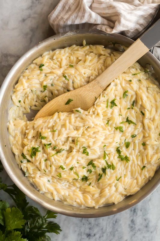<p>The Recipe Rebel</p><p>A one-pot recipe for tender orzo tossed in a light and cheesy cream sauce.</p><p><strong>Get the recipe: </strong><a href="https://www.thereciperebel.com/garlic-parmesan-orzo-pasta/?fbclid=IwAR15lahsIyx3x051MQDUl9xKYrIO-xUz_swaC53gqIj5buFV6EdOpA9qWJc" rel="nofollow noopener" target="_blank" data-ylk="slk:Garlic Parmesan Orzo Pasta;elm:context_link;itc:0;sec:content-canvas" class="link "><strong>Garlic Parmesan Orzo Pasta</strong></a></p>