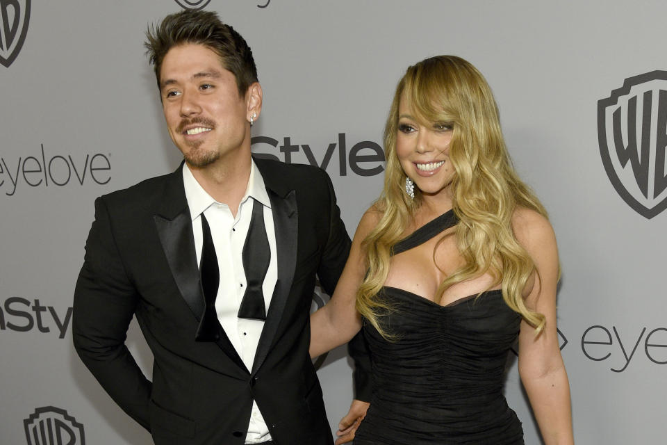 FILE - Bryan Tanaka, left, and Mariah Carey arrive at the InStyle and Warner Bros. Golden Globes afterparty at the Beverly Hilton Hotel, Jan. 7, 2018, in Beverly Hills, Calif. Carey and Tanaka have split after 7 years together, Tanaka has confirmed. In a statement shared with the Associated Press and published to Tanaka's Instagram on Tuesday, Dec. 26, 2023, Carey's backup dancer-turned-creative director and partner detailed their breakup. (Photo by Chris Pizzello/Invision/AP, File)