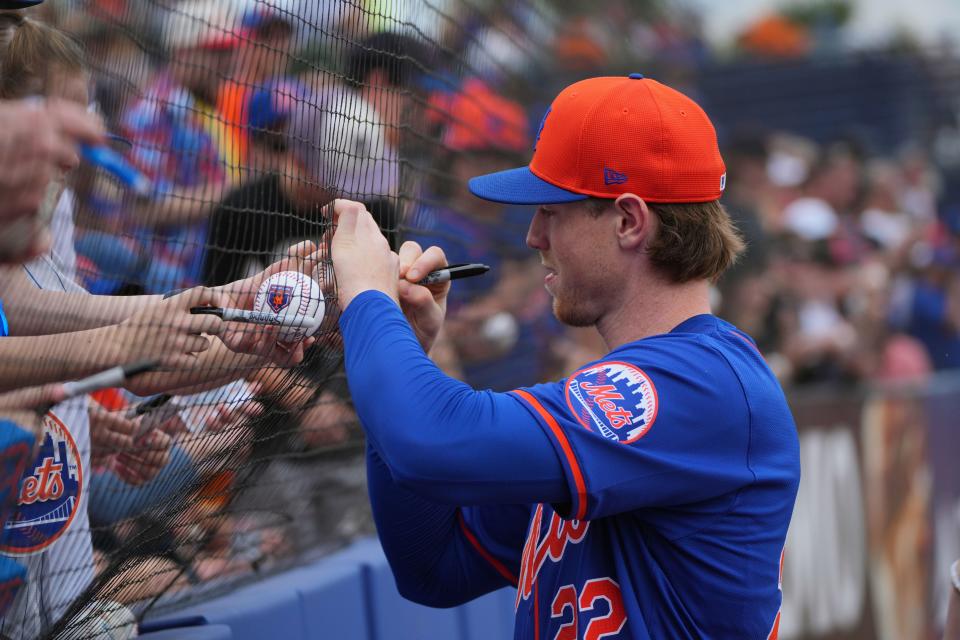 Mar 10, 2024; Port St. Lucie, Florida, USA; New York Mets third baseman Brett Baty (22) signs autographs before the game against the Detroit Tigers at Clover Park. Mandatory Credit: Jim Rassol-USA TODAY Sports