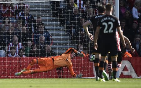 Britain Football Soccer - Southampton v Hull City - Premier League - St Mary's Stadium - 29/4/17 Hull City's Eldin Jakupovic saves a penalty from Southampton's Dusan Tadic Reuters / Hannah McKay Livepic