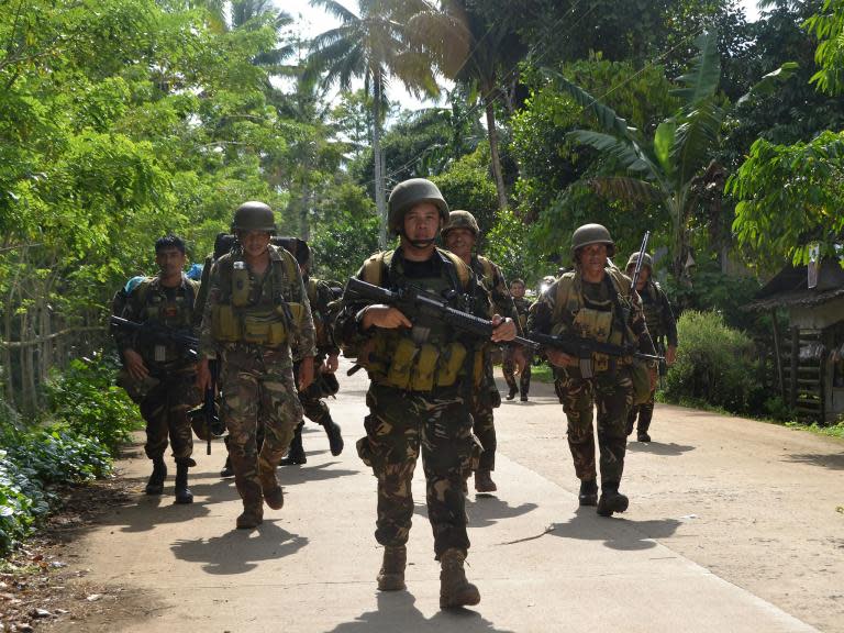 Hostage of Islamist militants swims to safety while another drowns and third shot in Philippines