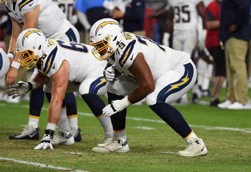 GLENDALE, ARIZONA - AUGUST 08: Trey Pipkins III #79 of the Los Angeles Chargers warms up prior to an NFL preseason game against the Arizona Cardinals at State Farm Stadium on August 08, 2019 in Glendale, Arizona. (Photo by Norm Hall/Getty Images)