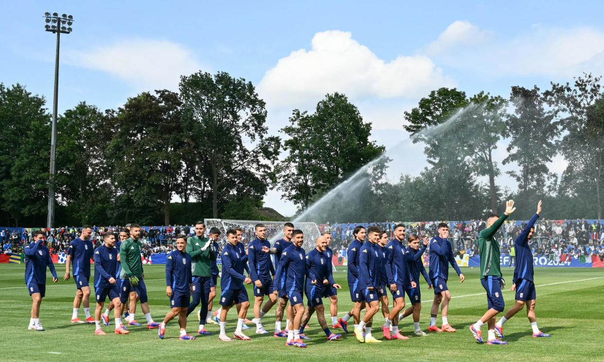 <span>Italy’s players greet supporters as they arrive for a public training session in Iserlohn.</span><span>Photograph: Alberto Pizzoli/AFP/Getty Images</span>