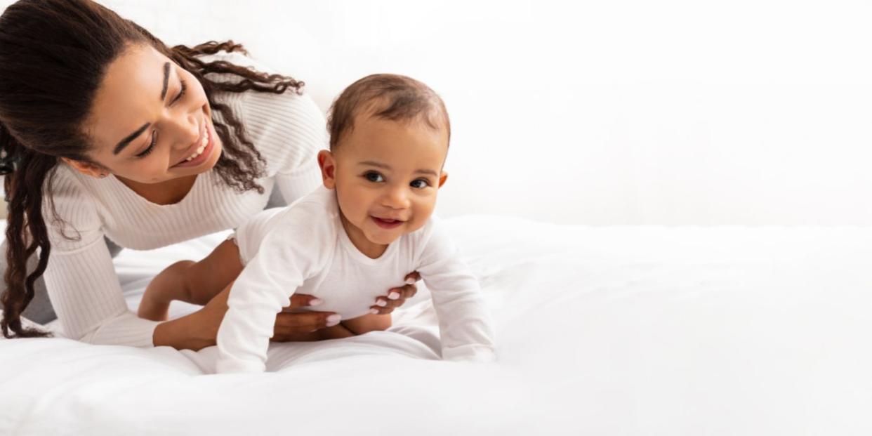 detaching from social media- mom playing with smiling baby