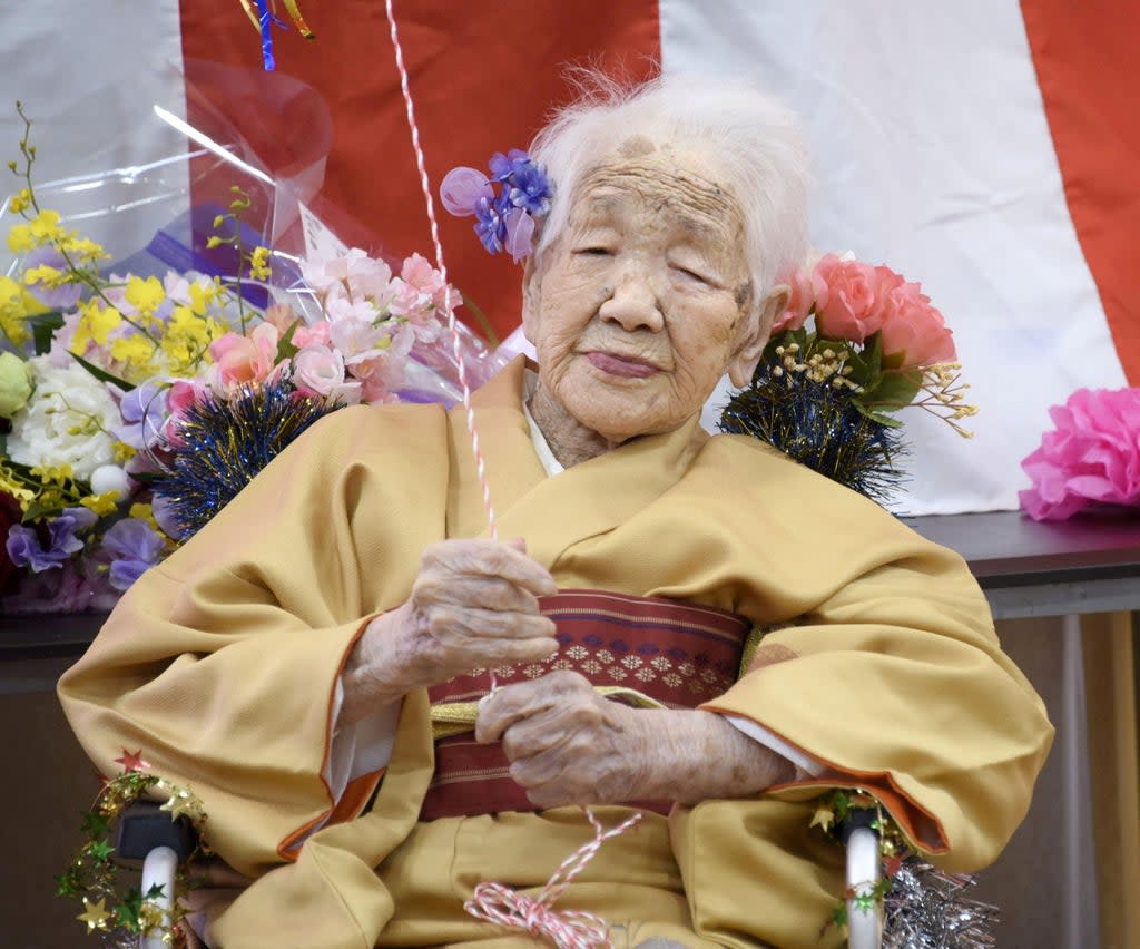 Kane Tanaka, born in 1903, smiles as a nursing home celebrates her birthday in January 2020  (REUTERS)