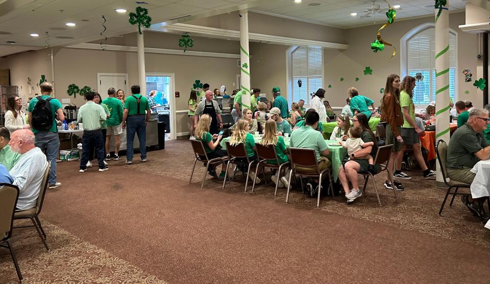 Parade goers grab some grub at Wesley Monumental United Methodist Church’s annual pancake breakfast, which benefits Wesley’s youth ministry.