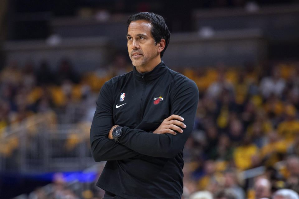 Miami Heat coach Erik Spoelstra watches the team play the Indiana Pacers during the first half of an NBA basketball game in Indianapolis, Saturday, Oct. 23, 2021. (AP Photo/Doug McSchooler)