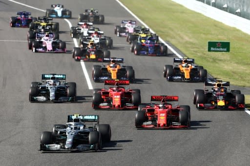 Sebastian Vettel twitched before the lights went out and his hesitation enabled the fast starting Valtteri Bottas (L) to leapfrog from third into the lead