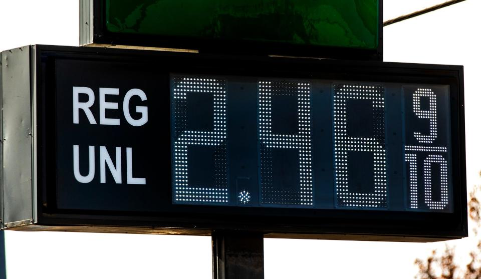 Gas price signs show the downward trend in the cost of gas on Friday in Oklahoma City.