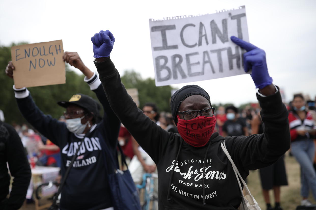 LONDON, ENGLAND - JUNE 03: A protester wearing a face mask holds a sign saying 'I can't breathe' during a Black Lives Matter protest in Hyde Park on June 3, 2020 in London, United Kingdom. The death of an African-American man, George Floyd, while in the custody of Minneapolis police has sparked protests across the United States, as well as demonstrations of solidarity in many countries around the world. (Photo by Dan Kitwood/Getty Images)