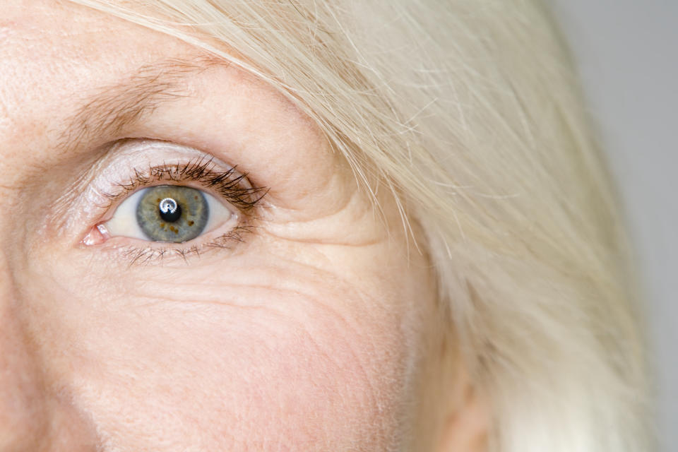 Close up photo of a mature woman's eye with crow's feet showing