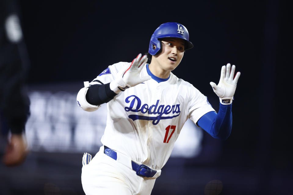 LOS ANGELES, CALIFORNIA - JULY 02:  Shohei Ohtani #17 of the Los Angeles Dodgers hits a two-run home run against the Arizona Diamondback in the seventh inning at Dodger Stadium on July 02, 2024 in Los Angeles, California. (Photo by Ronald Martinez/Getty Images)