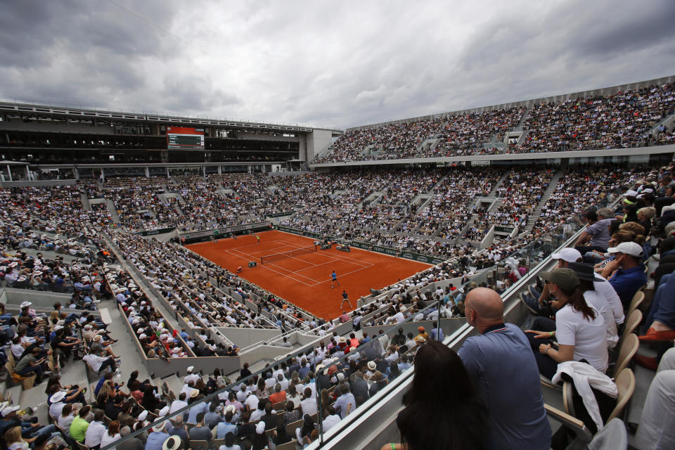 FILE - In this Sunday, June 9, 2019, file photo, Austria's Dominic Thiem, near side, plays a shot against Spain's Rafael Nadal during the men's final match of the French Open tennis tournament on the center court at Roland Garros stadium in Paris. (AP Photo/Christophe Ena, File)