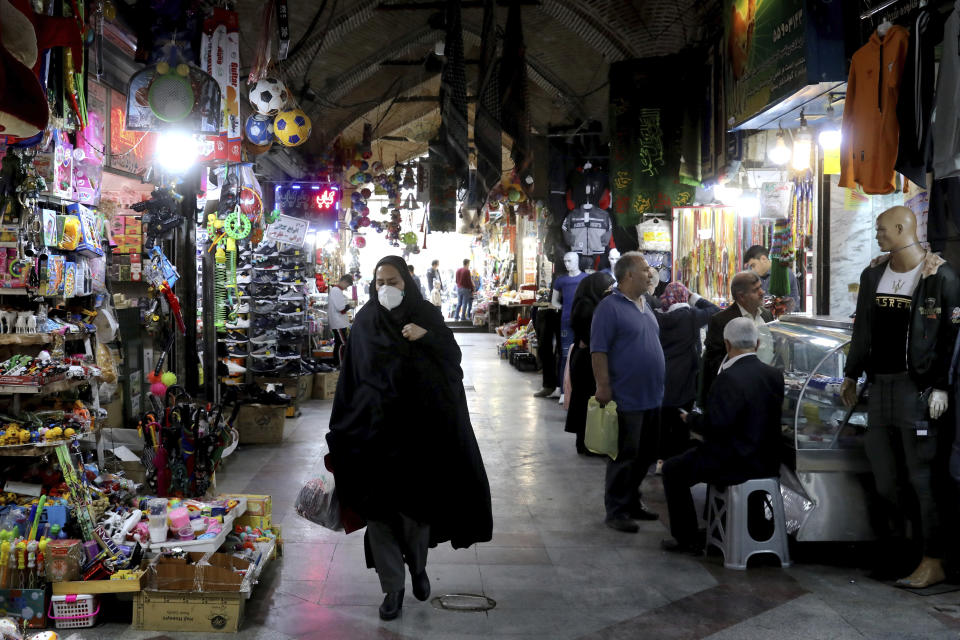 A pedestrian wears a mask to help guard against the new Coronavirus in Shahr-e-Ray, south of Tehran, Iran, Saturday, March, 7, 2020. Source: AP Photo/Ebrahim Noroozi