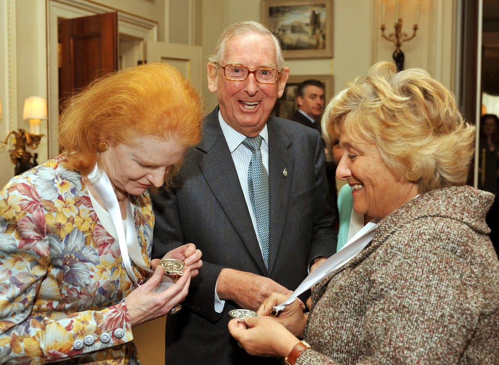 Lord Sainsbury laughs as Dr Carol Hogel CBE (left) and Dame Vivien Duffield CBE, study their Prince of Wales Medals for Arts Philanthropy at Clarence House in central London. (John Stillwell/PA) (PA Archive)
