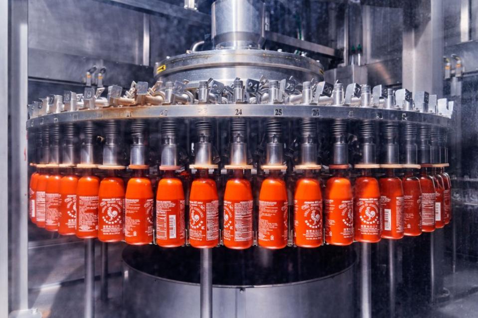 Sriracha bottles being filled at Huy Fong Foods' 650,000-square-foot factory in Irwindale, CA.