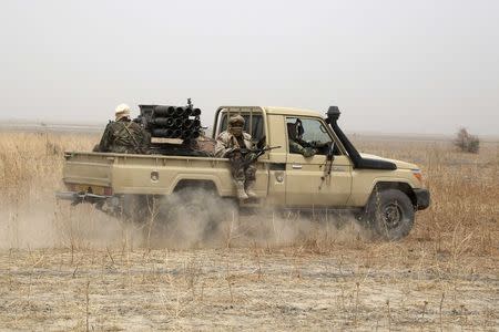 Chadian soldiers drive to the front line during battle against insurgent group Boko Haram in Gambaru, February 26, 2015. REUTERS/Emmanuel Braun