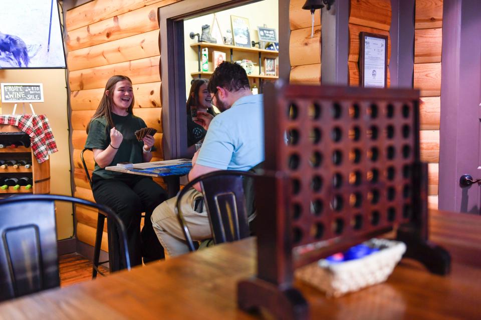 Hiker Hub bartender Tori Wagner plays Yu-Gi-Oh! with bar patron David Helm during game night at the Hiker Hub bar inside of Local Hiker in Spartanburg on Thursday, March 16, 2023.