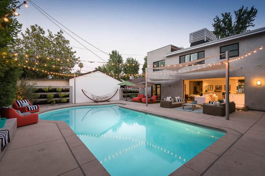 This stunning mid-century home has five bedrooms and five bathrooms.