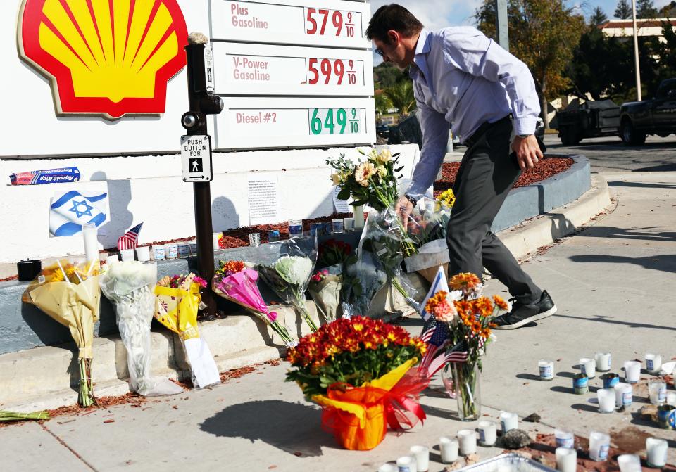 A person places flowers at a makeshift memorial at the site of an altercation between 69-year-old Paul Kessler, who was Jewish, and pro-Palestinian protestor on Nov. 7, 2023 in Thousand Oaks, California. Kessler died of a head injury he sustained from falling during the confrontation at dueling Israeli and Palestinian protests on November 5. The death was ruled a homicide by the Ventura County Medical Examiner’s Office.