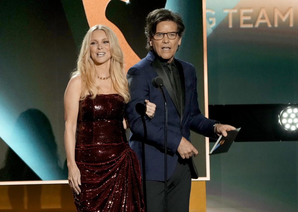 Lauralee Bell, left, and Michael Damian presents the award for outstanding writing team for a daytime drama series during the 50th Daytime Emmy Awards on Friday, Dec. 15, 2023, at the Westin Bonaventure Hotel in Los Angeles. (AP Photo/Chris Pizzello)