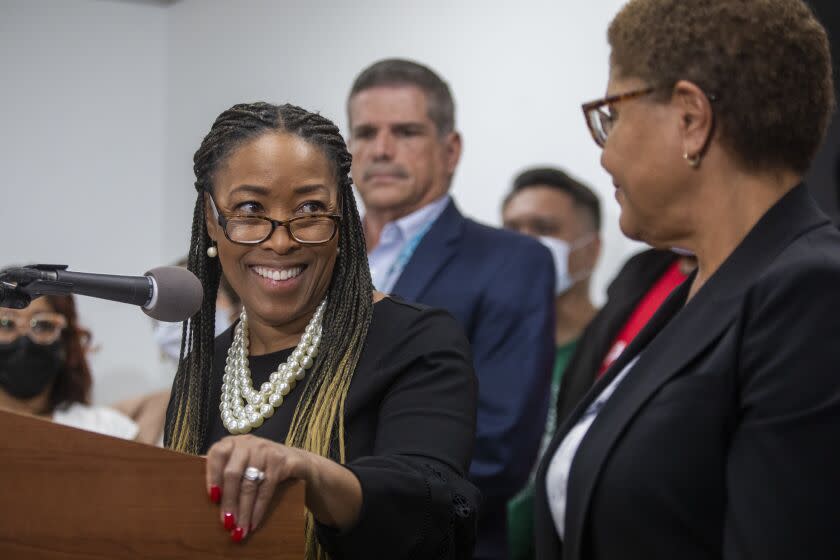 Los Angeles, CA - December 21: Dr. Va Lecia Adams Kellum, left, President and CEO of St. Joseph Center and Los Angele Mayor Karen Bass, right, speak during a press conference at The People Concern on Wednesday, Dec. 21, 2022, in Los Angeles, CA. Bass joins service providers and experts to sign her Executive Directive launching Inside Safe, Los Angeles' first citywide proactive housing-led strategy to bring people inside from tents and encampments for good, and to prevent encampments from returning. (Francine Orr / Los Angeles Times)