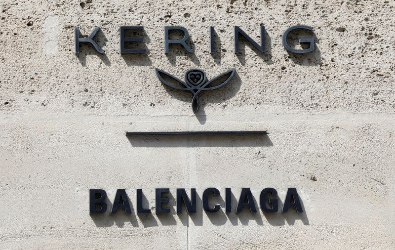 FILE PHOTO: The logos of French luxury group Kering and fashion house Balenciaga