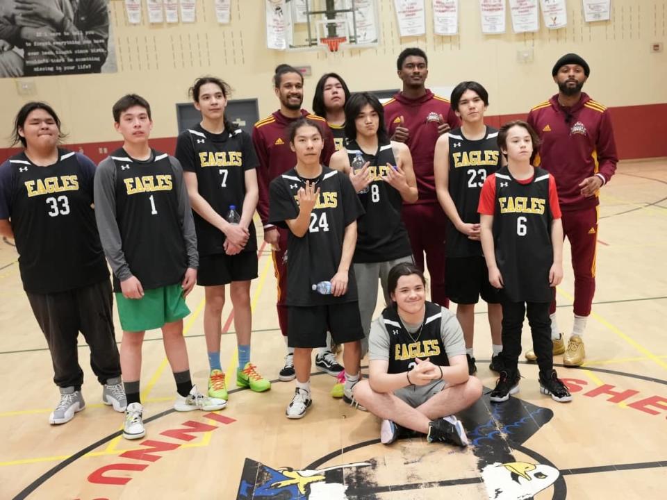 Members of the Newfoundland Rogues travelled to Sheshatshiu this week to host a basketball clinic with the Sheshatshiu Eagles. (John Gaudi/CBC - image credit)