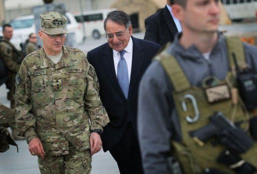 US Secretary of Defense Leon Panetta (C) talks with US Lieutenant General Curtis Scaparrotti in Kabul, Afghanistan. The Taliban broke off contacts over peace talks with Washington and the Afghan president demanded US troops leave village outposts, just days after an American soldier massacred 16 villagers