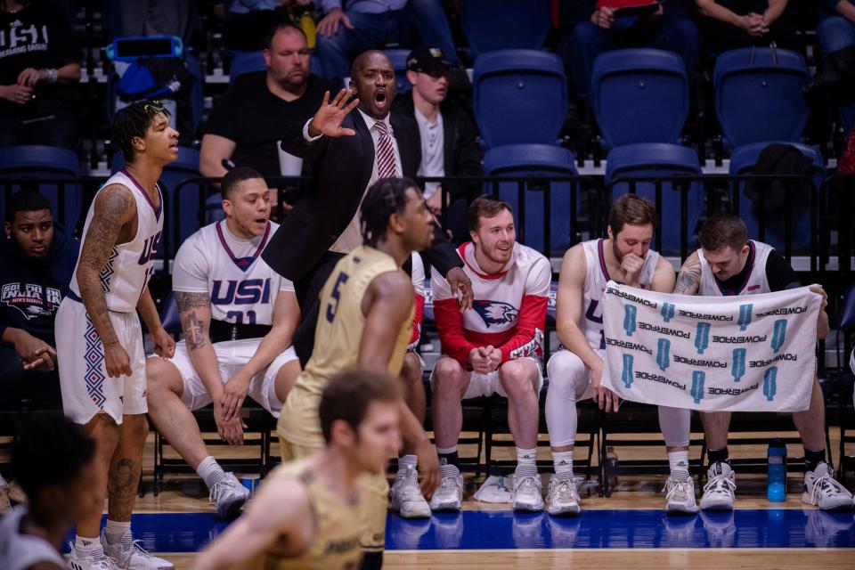 Southern Indiana head coach Stan Gouard communicates his message to his team against Illinois Springfield during their first-round game of the GLVC Men's Basketball Championship Tournament at Screaming Eagles Arena Monday night, Feb. 28, 2022.