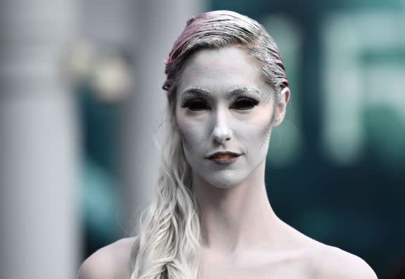 A woman in a dress by artist Ryan Jude Novelline poses during New York Comic Con 2017 at Javits Center on October 5, 2017 in New York City.  / AFP PHOTO / ANGELA WEISS        (Photo credit should read ANGELA WEISS/AFP/Getty Images)