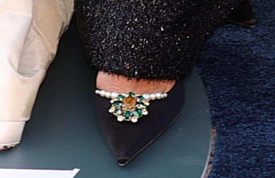 A closer look at Rita Ora’s black pointy-toed pumps featuring a bejeweled toe design. - Credit: Variety