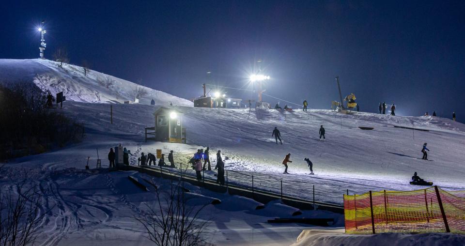 Skiers and snowboarders enjoy a perfect evening at The Rock Snowpark in Franklin on Jan. 2, 2021. The park offers skiing, snowboarding and tubing for all ages and skill levels.