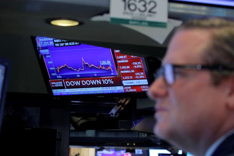 Traders on the floor of the New York Stock Exchange (NYSE) after the close of trading in New York