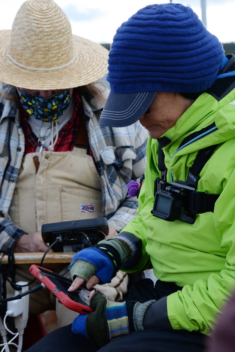 Little Traverse Bay Bands of Odawa Indians tribal council member Fred Harrington Jr., left, and Terri Wilkerson of Pinckney operate an underwater, remote-operated vehicle reviewing the Straits of Mackinac lake bottom near the Line 5 oil pipeline in this September 2020 photo.