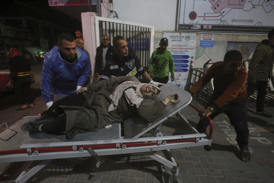 Palestinians wounded in the Israeli bombardment of the Gaza Strip are brought to a hospital in Rafah, Monday, Dec. 11, 2023. (AP Photo/Hatem Ali)