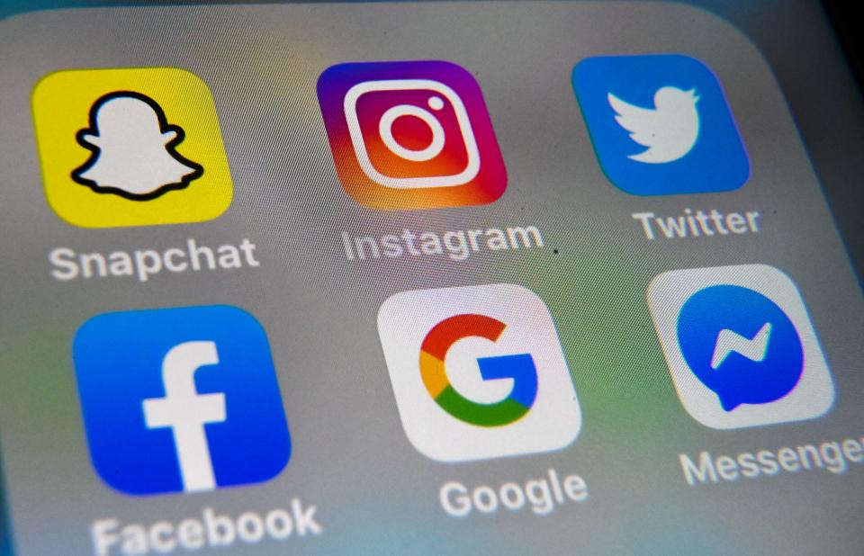 A picture taken on October 1, 2019 in Lille shows the logo of mobile app Instagram, Snapchat, Twitter, Facebook, Google and Messenger are displayed on a tablet. (Photo by DENIS CHARLET / AFP) (Photo by DENIS CHARLET/AFP via Getty Images)