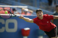 Jenson Brooksby reaches for the ball against against Kevin Anderson, of South Africa, during a match in the Citi Open tennis tournament, Monday, Aug. 2, 2021, in Washington. (AP Photo/Nick Wass)