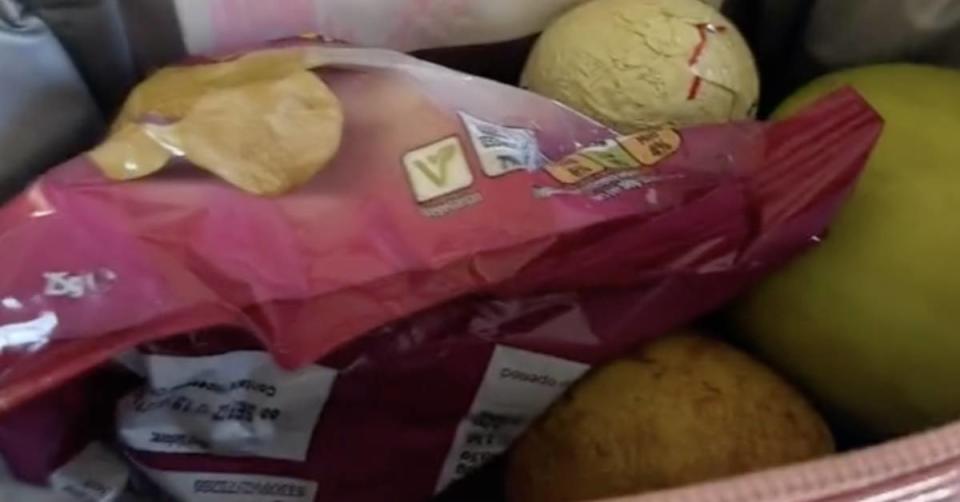 The lunchbox contained. a packet of chips, an apple, a pear and a chocolate egg. Source: TikTok