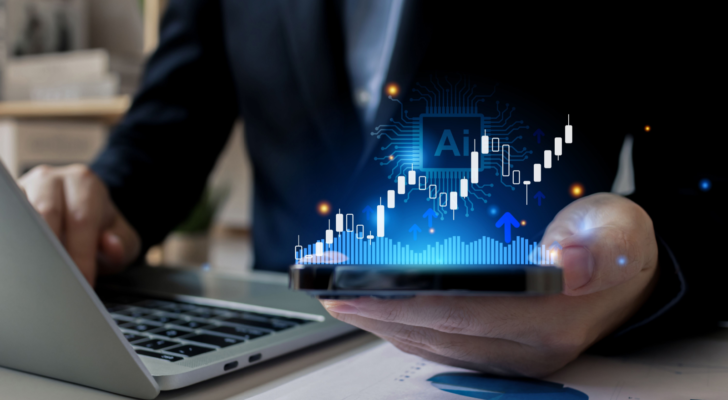 A businessman in a suit holding a phone in his hand, showing a rising candlestick graph and the text AI to portray AI-driven trading