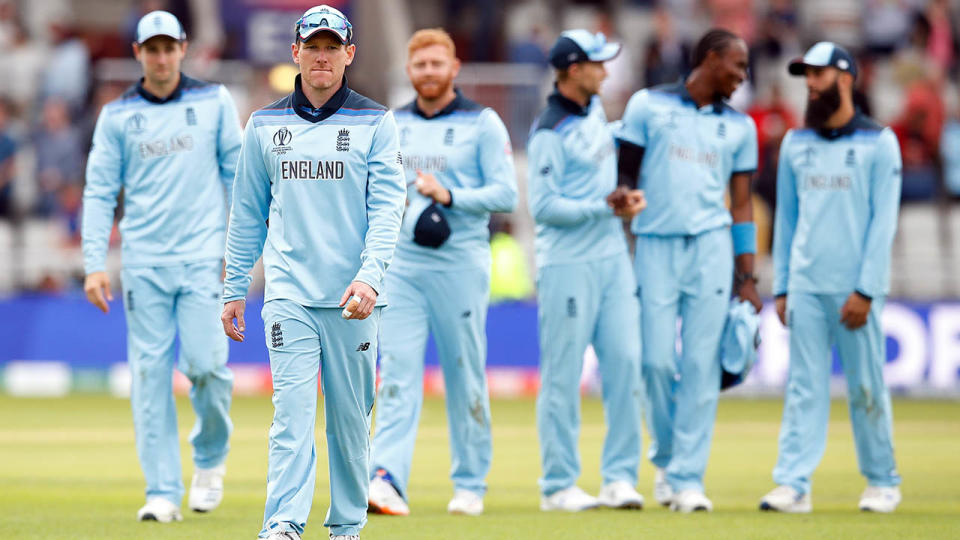 Eoin Morgan and teammates celebrate. (Photo by Martin Rickett/PA Images via Getty Images)