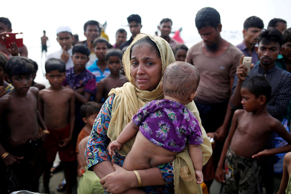 <p>A Rohingya refugee woman cries after crossing the Bangladesh-Myanmar border by boat through the Bay of Bengal in Teknaf, Bangladesh, Sept. 5, 2017. (Photo: Mohammad Ponir Hossain/Reuters) </p>