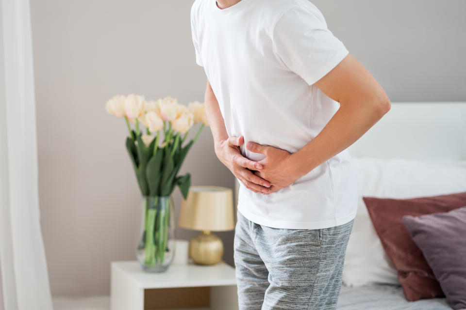 Man with pancreatitis pain. (Getty Images)