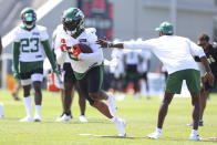 New York Jets running back Tevin Coleman (22) runs a drill during practice at the team's NFL football training facility, Saturday, July. 31, 2021, in Florham Park, N.J. (AP Photo/Rich Schultz)