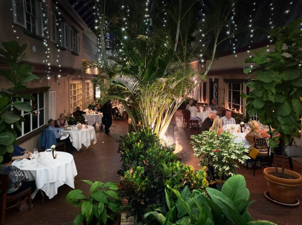 Fine-dining restaurant Michael's on East, located in the Midtown Plaza just south of downtown Sarasota, offers indoor seating with a 1940s supper club atmosphere, as well as outdoor tables in the atrium under a canopy of twinkling lights